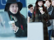倪妮素颜现身机场 背小红书包边走边喝咖啡
