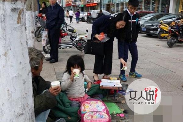 女孩边写作业边乞讨 顶寒风苦读难掩殷切求学心令人汗颜